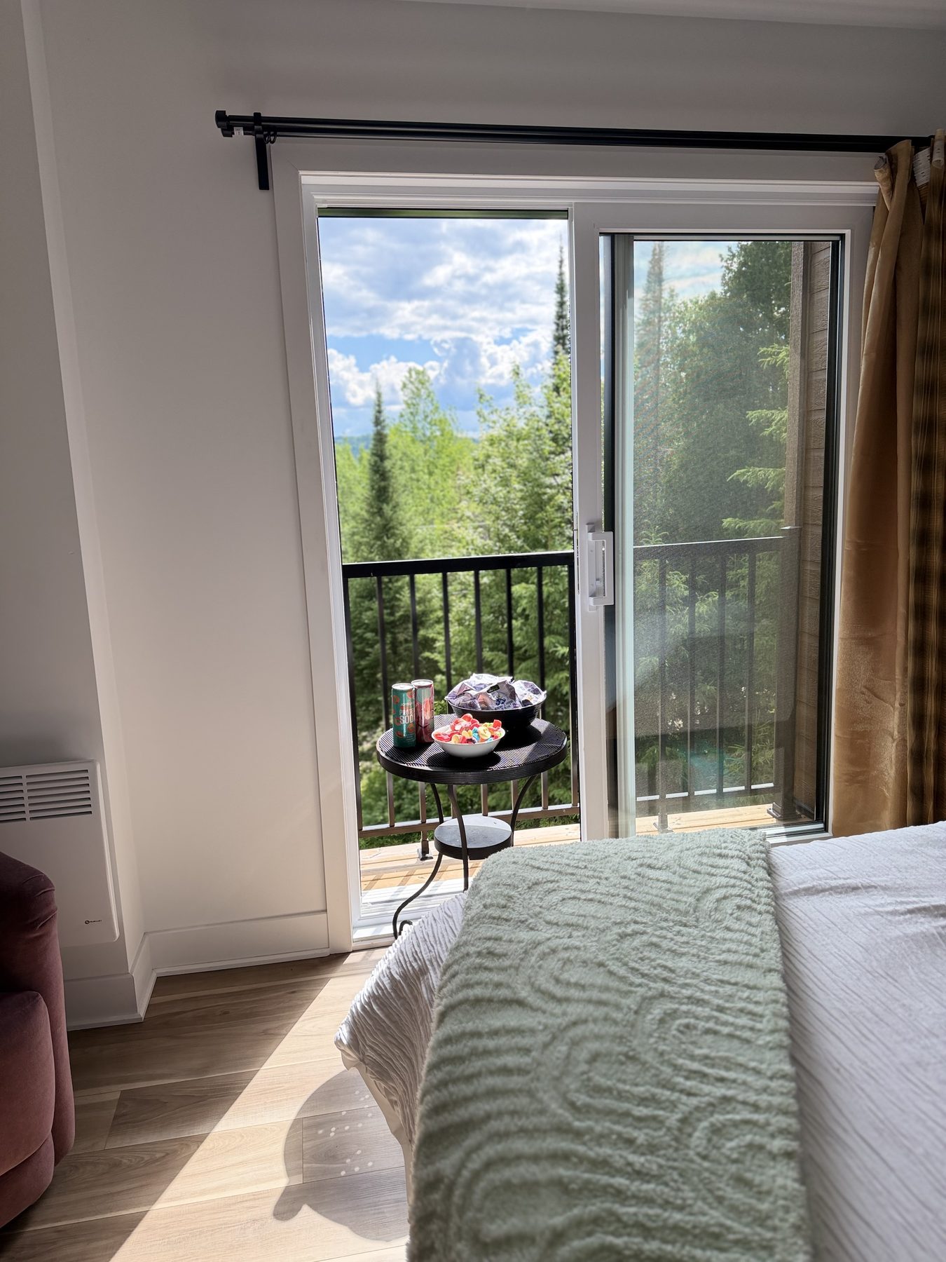 Chalet bedroom with a snack table near the outdoor view