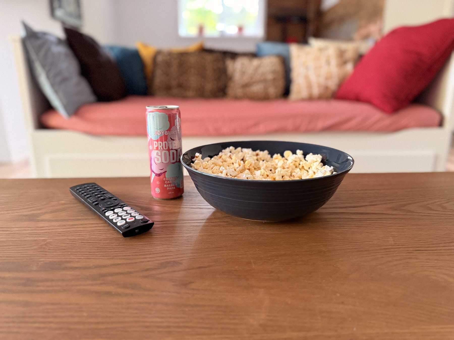 Popcorn, a drink and the remote ready on the living-room table